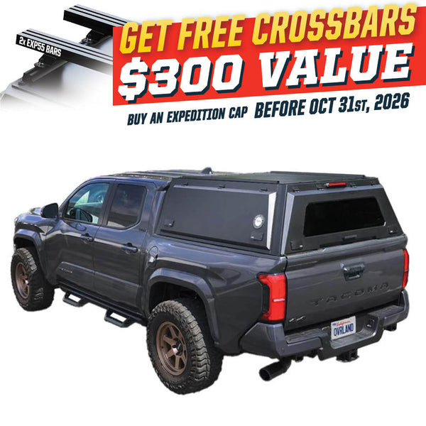 OVS Expedition PRO (2024–2027 Tacoma) — Feature shot: three-quarter view with optional OVS crossbars
