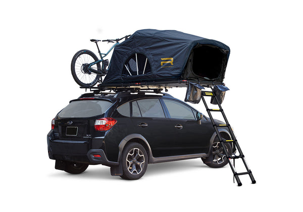 Roofnest Meadowlark — Feature shot: open soft shell tent on a black Subaru Crosstrek, rear view with ladder and bike on top