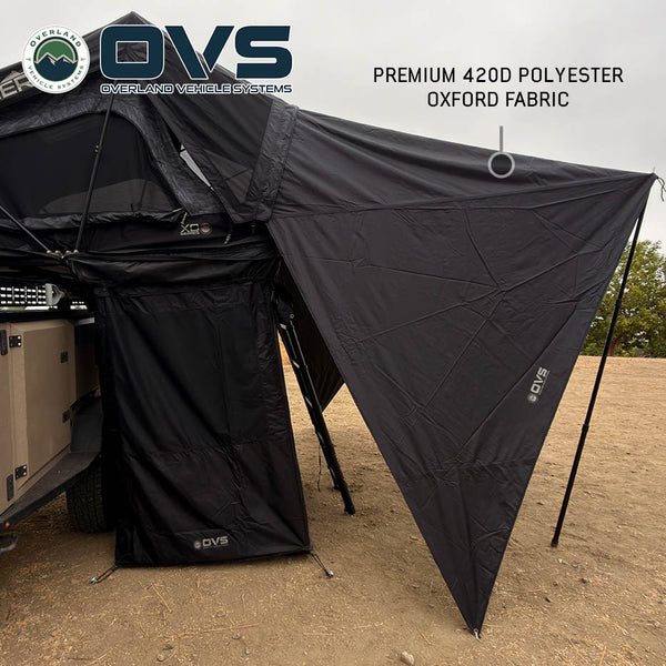 OVS XD Sherpa Tent Awning — Lifestyle shot: 420D polyester awning over a Sherpa tent on a trailer at camp. Shade at the tent door for overland trailer setups