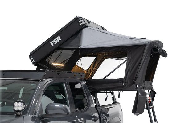 FSR Kali — Feature shot: side-profile view of the deployed hard-shell aluminum tent on a truck bed rack