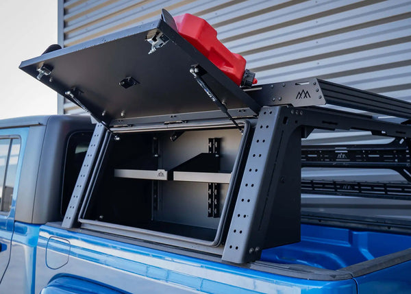 Backwoods Adventure Mods Bed Rack Storage Box (2020–2027 Gladiator) — Feature shot: box on the bed rack with the lid open showing shelves