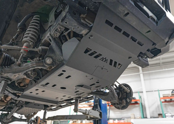 Backwoods Adventure Mods Aluminum Skid Plate System (2005–2023 Tacoma) — Feature shot: skid plates installed under a Tacoma