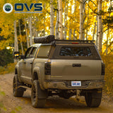 OVS Expedition PRO (2007–2021 Tundra) — Lifestyle shot: cap in use outdoors, set up for hauling gear and camping trips
