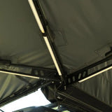 NaturNest 270 Awning Plus — Feature shot: ground stakes and guylines securing the canopy