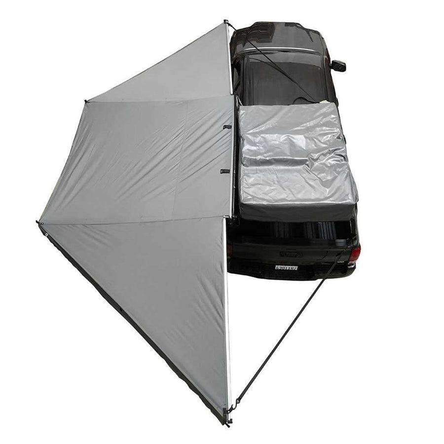 OVS HD Nomadic 180 Awning — Feature shot: overhead view of the fully opened awning with its travel cover