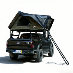 Black Ford truck with a rooftop tent on a white background