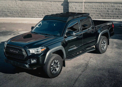 Backwoods Adventure Mods DRIFTR Roof Rack (2005–2023 Tacoma) — Feature shot: rack installed on a black Tacoma
