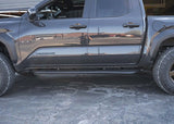 Backwoods Adventure Mods Rock Sliders (2024–2027 Tacoma) — Feature shot: side profile of the slider with built-in side step