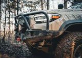 Backwoods Adventure Mods Hi-Lite Bull Bar (2016–2023 Tacoma) — Feature shot: ground clearance with winch and pod lights mounted