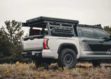 Backwoods Adventure Mods DRIFTR Bed Rack Topper (2007–2027 Tundra) — Feature shot: topper on the bed rack with accessories installed