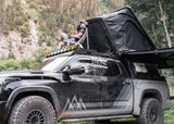Backwoods Adventure Mods DRIFTR Roof Rack (2022–2027 Tundra) — Lifestyle shot: camp chair on the rack beside a rooftop tent