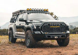 Backwoods Adventure Mods Lo-Pro Front Bumper (2022–2027 Tundra) — Lifestyle shot: overland Tundra with the bumper, roof rack and bed rack