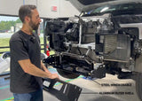 Backwoods Adventure Mods Lo-Pro Front Bumper (2022–2027 Tundra) — Feature shot: technician fitting the two-piece aluminum and steel bumper