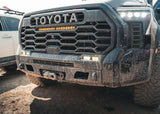 Backwoods Adventure Mods Lo-Pro Front Bumper (2022–2027 Tundra) — Lifestyle shot: mud-splattered bumper after a day off road
