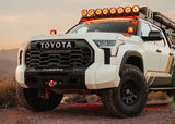 Backwoods Adventure Mods Lo-Pro Front Bumper (2022–2027 Tundra) — Lifestyle shot: Tundra driving with off-road lights lit