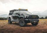 Backwoods Adventure Mods Lo-Pro Front Bumper (2022–2027 Tundra) — Lifestyle shot: front of a 3rd gen Tundra off road with the bumper