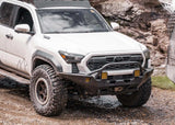 Backwoods Adventure Mods Hi-Lite Prerunner (2024–2027 Tacoma) — Feature shot: high-clearance hybrid bumper with prerunner bar