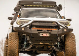 Backwoods Adventure Mods Hi-Lite Prerunner (2010–2024 4Runner) — Lifestyle shot: white overland 4Runner showing the high-clearance prerunner bumper
