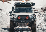 Backwoods Adventure Mods Hi-Lite Bull Bar (2010–2024 4Runner) — Lifestyle shot: white 4Runner with the bull bar bumper driving in snow