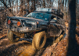 Backwoods Adventure Mods Hi-Lite Bull Bar (2010–2024 4Runner) — Lifestyle shot: white 4Runner working an off-road trail with the bull bar bumper