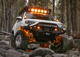 Backwoods Adventure Mods Hi-Lite Prerunner (2010–2024 4Runner) — Lifestyle shot: 4Runner on a night trail with LED lights on the bumper