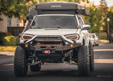 Backwoods Adventure Mods Hi-Lite Prerunner (2010–2024 4Runner) — Lifestyle shot: 4Runner at dusk with a winch and LED lights on the bumper