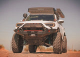 Backwoods Adventure Mods Hi-Lite Prerunner (2010–2024 4Runner) — Lifestyle shot: white 4Runner driving off road with the prerunner winch bumper