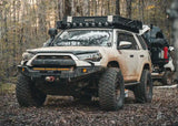 Backwoods Adventure Mods Hi-Lite No Bull Bar (2010–2024 4Runner) — Lifestyle shot: mud-covered white 4Runner on an off-road trail