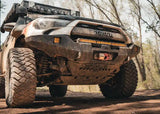 Backwoods Adventure Mods Connector Skid Plate (2010–2024 4Runner) — Lifestyle shot: mud-covered 4Runner with the connector skid on the trail