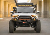 Backwoods Adventure Mods Hi-Lite Prerunner (2010–2024 4Runner) — Lifestyle shot: overland 4Runner build with the prerunner bumper