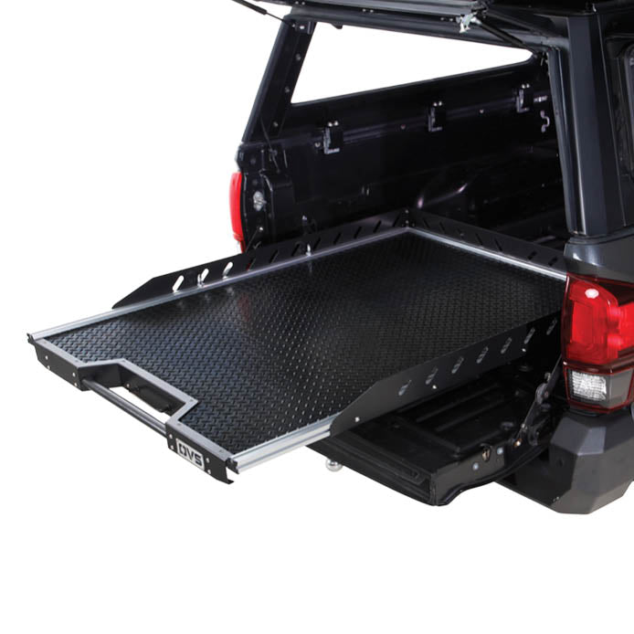 OVS Truck Bed Extension Cargo Slide – Short Bed — Lifestyle shot: three-quarter view installed in a truck bed; cargo pulled out to the tailgate for easy loading at camp or the job site.