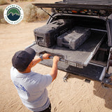OVS Truck Bed Extension Cargo Slide – Short Bed — Lifestyle shot: bed slide extended from a pickup at camp; cargo pulled out to the tailgate for easy loading at camp or the job site.