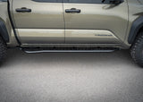 Backwoods Adventure Mods Rock Sliders (2024–2027 Tacoma) — Feature shot: side profile of the installed slider