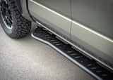 Backwoods Adventure Mods Rock Sliders (2024–2027 Tacoma) — Feature shot: slider running along the cab from the front wheel