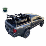 OVS Discovery Bed Rack – Mid-Size Truck Short Bed — Lifestyle shot: Tacoma with the rack and a closed rooftop tent; rooftop tent, awning and recovery gear carried above the bed for multi-day trips.