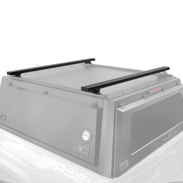OVS Expedition Crossbars 55 in — Feature shot: pair of black crossbars mounted on an Expedition cap's roof rails