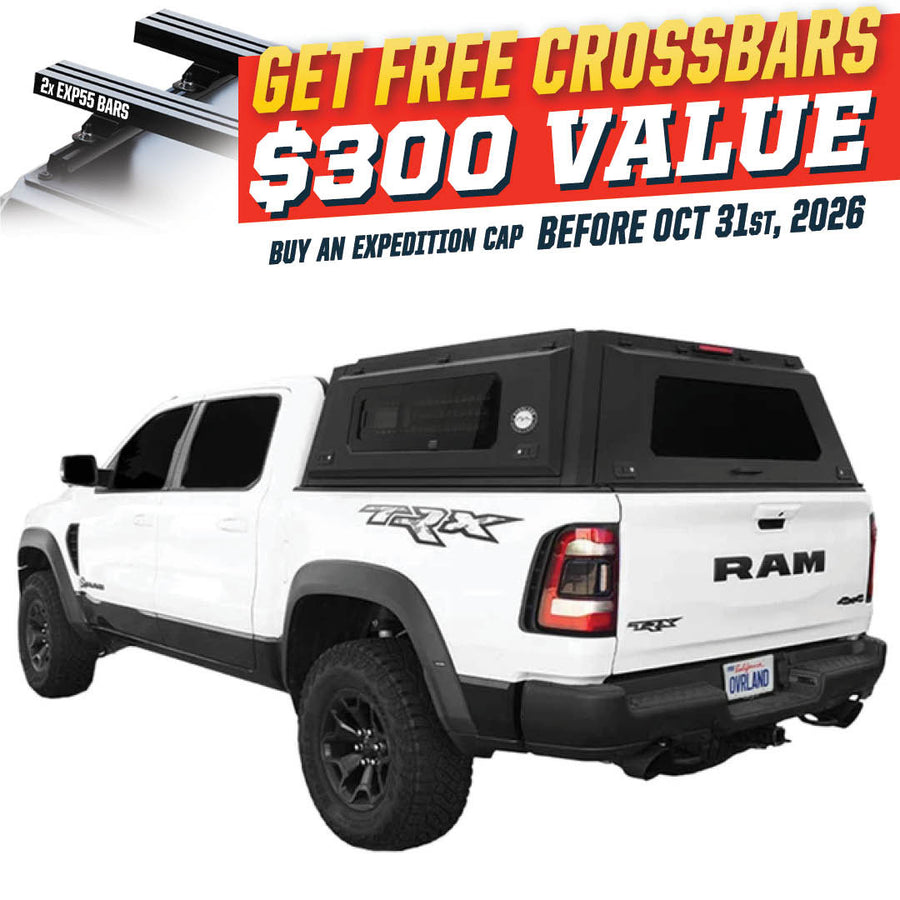 OVS Expedition PRO+ (2019–2027 RAM 1500) — Feature shot: three-quarter view with optional OVS crossbars
