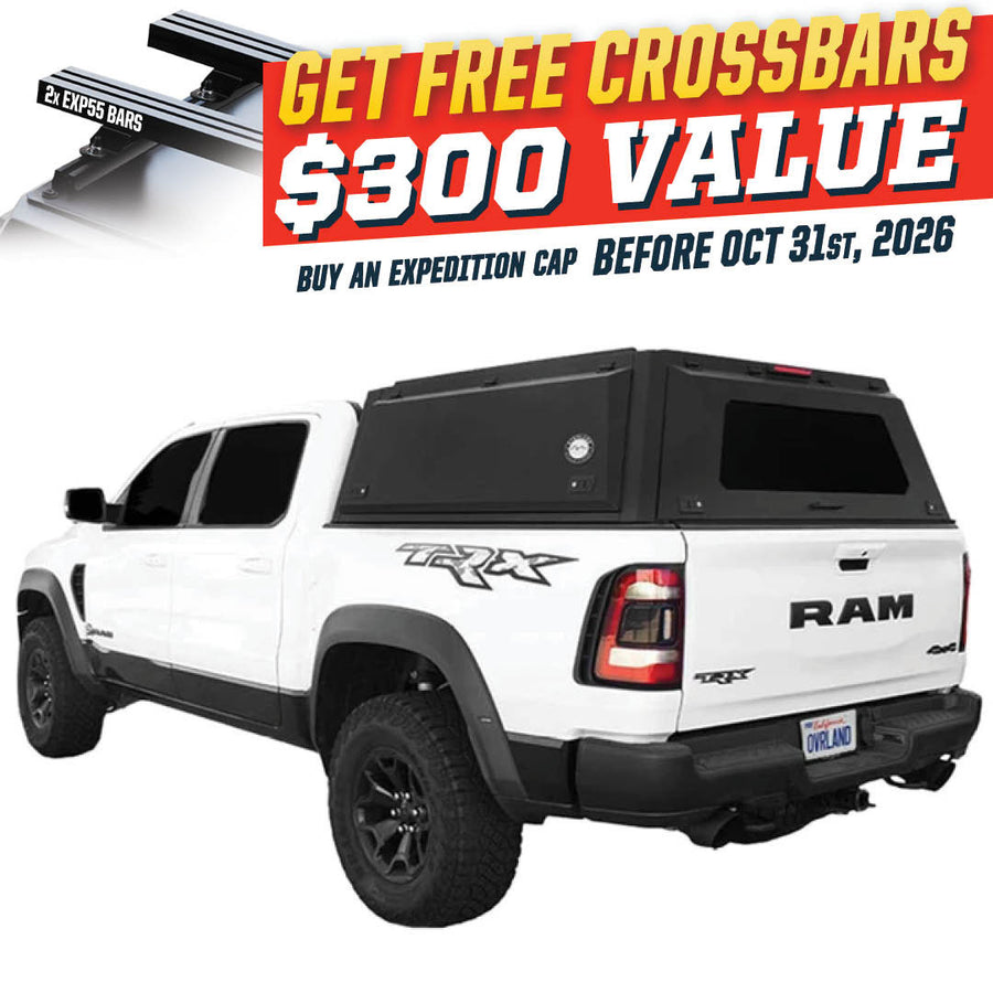 OVS Expedition PRO (2019–2027 RAM 1500) — Feature shot: three-quarter view with optional OVS crossbars