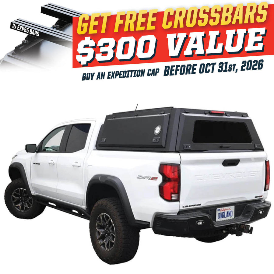 OVS Expedition PRO (2023–2027 Colorado / Canyon) — Feature shot: three-quarter view with optional OVS crossbars