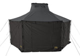 Roofnest Falcon 3 EVO Air Awnex — Feature shot: annex walls deployed under the awning with mesh-lined doors