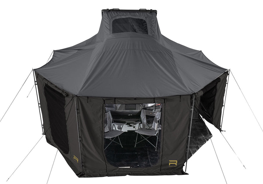 Roofnest Falcon 3 EVO Air Awnex — Lifestyle shot: complete Awnex set up beneath a Falcon 3 EVO Air, giving a covered room off the side of the vehicle at camp