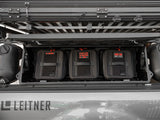 GearBAG G2 3-Pack — Lifestyle shot: three labeled GearBAGs mounted inside an open GearPOD XL on a truck bed rack, flanked by jerry cans, ready for the trail.