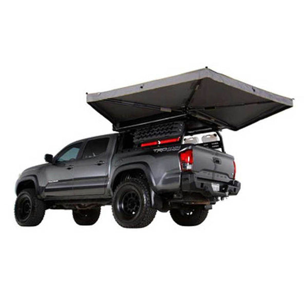 OVS HD Nomadic 270 LTE Awning — Feature shot: deployed on a pickup with a camper shell