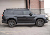Backwoods Adventure Mods DRIFTR Roof Rack (2024–2027 GX550) — Lifestyle shot: black GX550 with the rack, ready for a trip