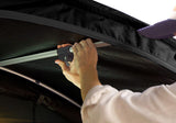Roofnest Meadowlark — Feature shot: unfolding the tent by hand during the 3-step setup