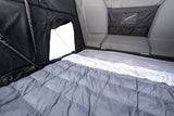 Roofnest Condor 2 XXL Air — Feature shot: Rest EZ Sleep System with self-inflating foamcore mattress, bamboo sheets and Puffy Blanket inside the tent