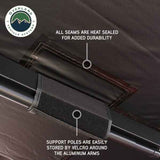 OVS XD Nomadic 180 Awning — Feature shot: heat-sealed seams and support poles stowed along the rafters
