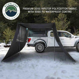 OVS XD Nomadic 90 Awning Wall Kit — Lifestyle shot: blackout side walls on a 90 awning at a forest camp. Private shade for one-vehicle camps