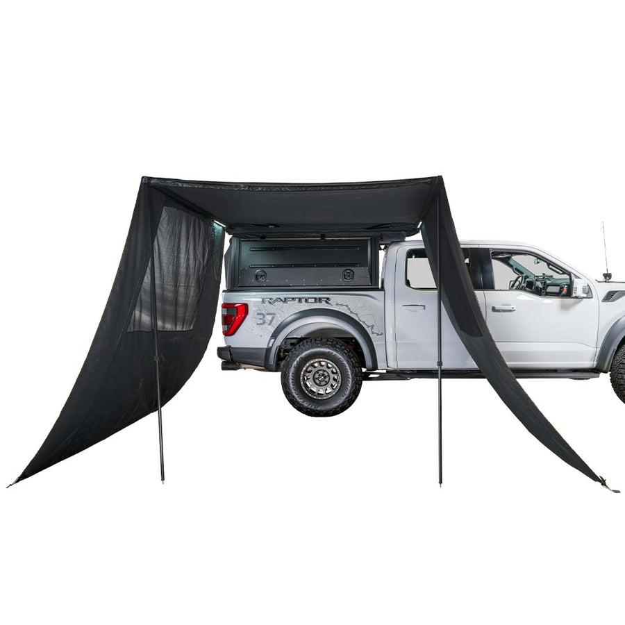 OVS XD Nomadic 90 Awning Wall Kit — Feature shot: blackout walls installed on both sides of a 90 awning on a pickup