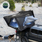 OVS XD Atlas — Lifestyle shot: tent open on a truck in a desert canyon, a ready-for-anything base camp